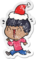 laughing hand drawn distressed sticker cartoon of a man wearing santa hat png