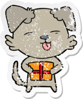 distressed sticker of a cartoon dog with christmas present png