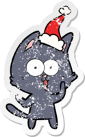 funny hand drawn distressed sticker cartoon of a cat wearing santa hat png
