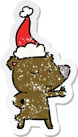 happy hand drawn distressed sticker cartoon of a bear giving thumbs up wearing santa hat png