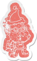 quirky cartoon distressed sticker of a joyful man with beard and parcel under arm wearing santa hat png