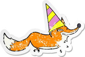 distressed sticker of a cartoon sly fox in party hat png