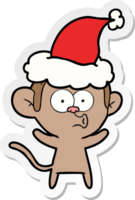 main tiré autocollant dessin animé de une surpris singe portant Père Noël chapeau png