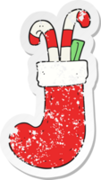 pegatina retro angustiada de un calcetín de navidad de dibujos animados png