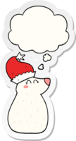 cartoon bear wearing christmas hat with thought bubble as a printed sticker png