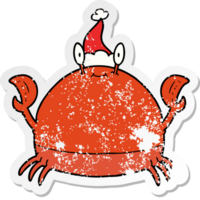 hand drawn distressed sticker cartoon of a crab wearing santa hat png