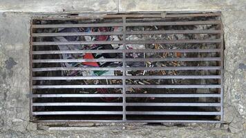 Turin, Italy, juni 21, 2021, a street grate along a sidewalk of a Turin street. photo