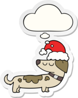 cartoon dog wearing christmas hat with thought bubble as a printed sticker png