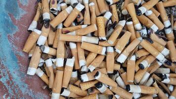 of a jar full of cigarette butts photo