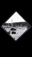 The rhomboid window of a door overlooking the winter landscape of Scandinavia. photo