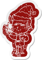 cartoon distressed sticker of a man sweating wearing santa hat png