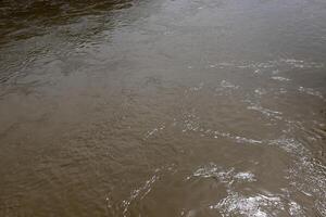 The color of water in the Mediterranean Sea in shallow water. Natural abstract background. photo