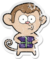 distressed sticker of a cartoon christmas monkey png