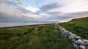 Beautiful coastal sunset landscape scenery of wild Atlantic way at Silverstrand beach, Galway, Ireland, nature background, wallpaper photo