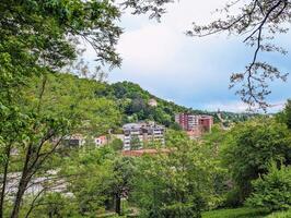 Beautiful cityscape scenery of buildings and architecture in old town surrounded by forest and hills at Krapina, Croatia, County Hrvatsko zagorje photo