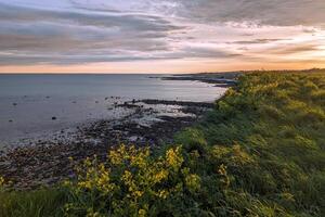 Beautiful coastal sunset landscape scenery of wild Atlantic way at Silverstrand beach, Galway, Ireland, nature background, wallpaper photo