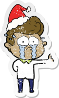 distressed sticker cartoon of a crying man wearing santa hat png