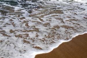 The color of water in the Mediterranean Sea in shallow water. Natural abstract background. photo