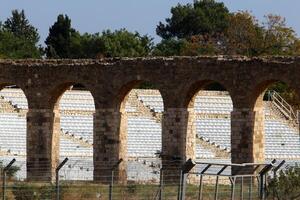 An ancient aqueduct for supplying water to populated areas. photo
