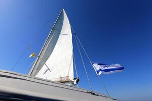 Masts in the port against the blue sky. photo