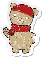 retro distressed sticker of a cartoon teddy bear in winter hat and scarf png