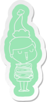 pegatina de dibujos animados de un niño feliz con una pila de libros con sombrero de santa png