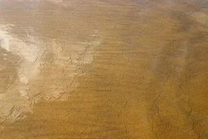 The color of water in the Mediterranean Sea in shallow water. Natural abstract background. photo