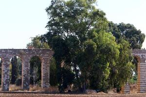 An ancient aqueduct for supplying water to populated areas. photo