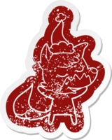 friendly cartoon distressed sticker of a fox wearing santa hat png