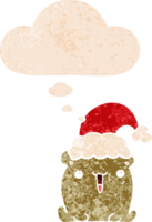 cute cartoon bear with christmas hat and thought bubble in retro textured style png