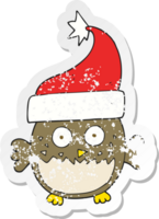 retro distressed sticker of a cartoon owl wearing christmas hat png