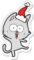 dessin animé drôle d'autocollant d'un chat portant un bonnet de noel png