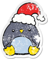 distressed sticker of a cute cartoon penguin wearing christmas hat png