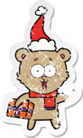 riendo osito de peluche con regalo de navidad con gorro de Papá Noel png