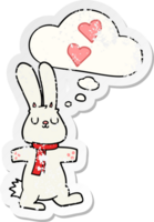 lapin de dessin animé amoureux et bulle de pensée comme un autocollant usé en détresse png