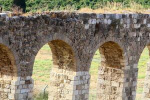 An ancient aqueduct for supplying water to populated areas. photo