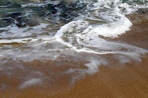 The color of water in the Mediterranean Sea in shallow water. Natural abstract background. photo