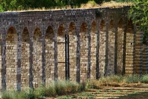An ancient aqueduct for supplying water to populated areas. photo