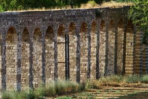 An ancient aqueduct for supplying water to populated areas. photo