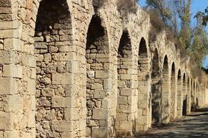 An ancient aqueduct for supplying water to populated areas. photo