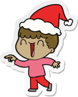 en riant main tiré autocollant dessin animé de une homme montrer du doigt portant Père Noël chapeau png