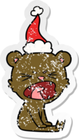 en colère main tiré affligé autocollant dessin animé de une ours portant Père Noël chapeau png