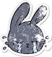 distressed sticker of a cartoon rabbit face crying png