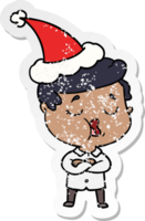 hand drawn distressed sticker cartoon of a man talking wearing santa hat png