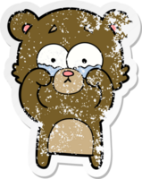 distressed sticker of a cartoon crying bear rubbing eyes png