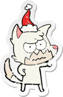 hand drawn distressed sticker cartoon of a annoyed fox wearing santa hat png