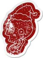 quirky cartoon distressed sticker of a skull wearing santa hat png