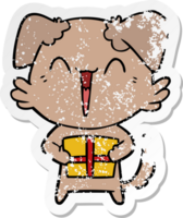 distressed sticker of a happy little cartoon dog with present png