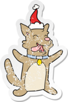 main tiré affligé autocollant dessin animé de une content chien portant Père Noël chapeau png