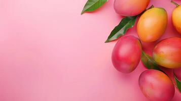 Mango fruits top view on the pastel background photo